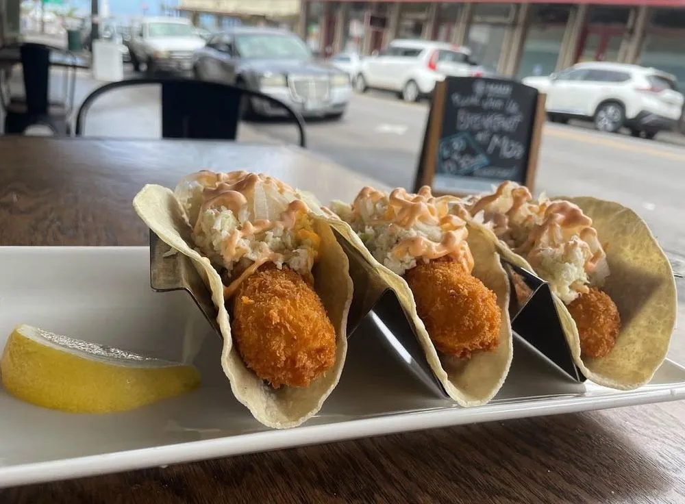 Panko-fried shrimp on a plate, ready to feed a crowd.